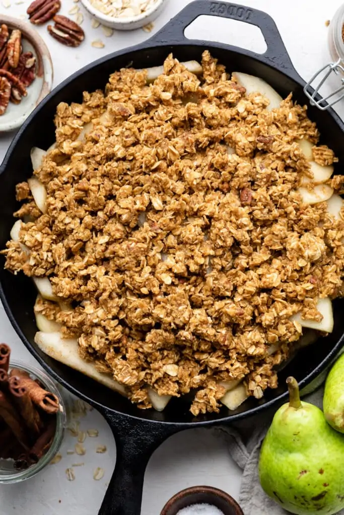 pear crisp in skillet before oven
