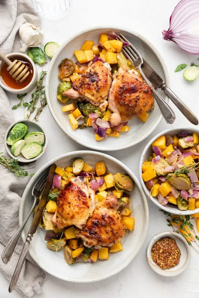 chicken and veggies in serving bowls