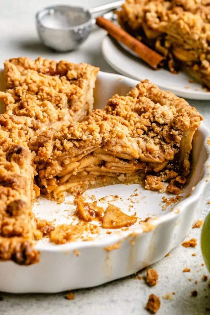 slice of apple pie in dish