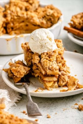 slice of pie on plate with ice cream