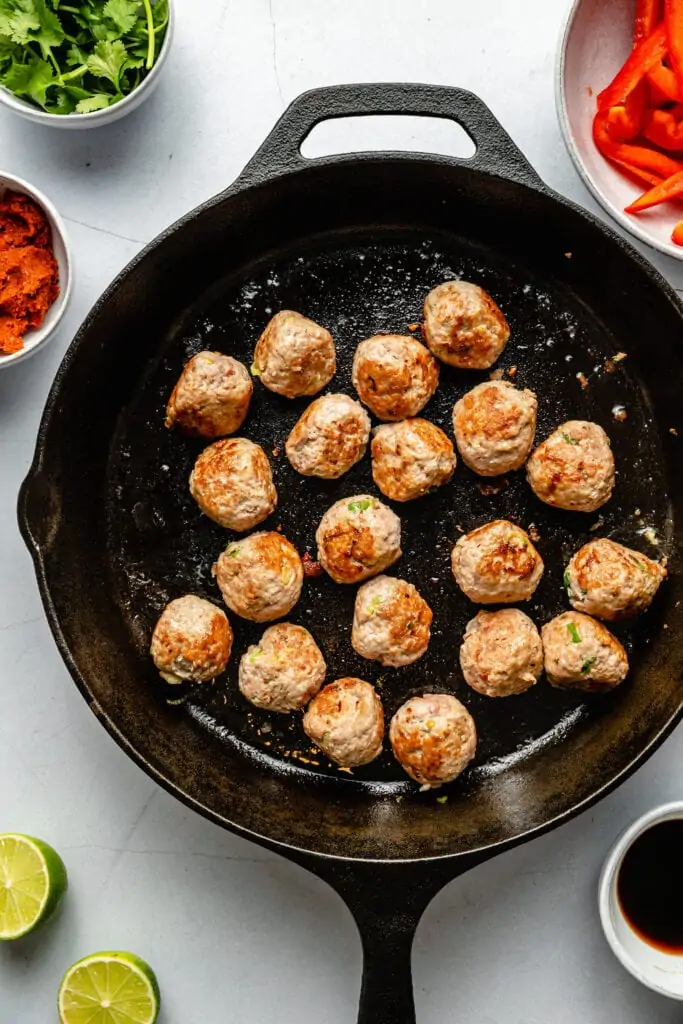 meatballs browning in pan