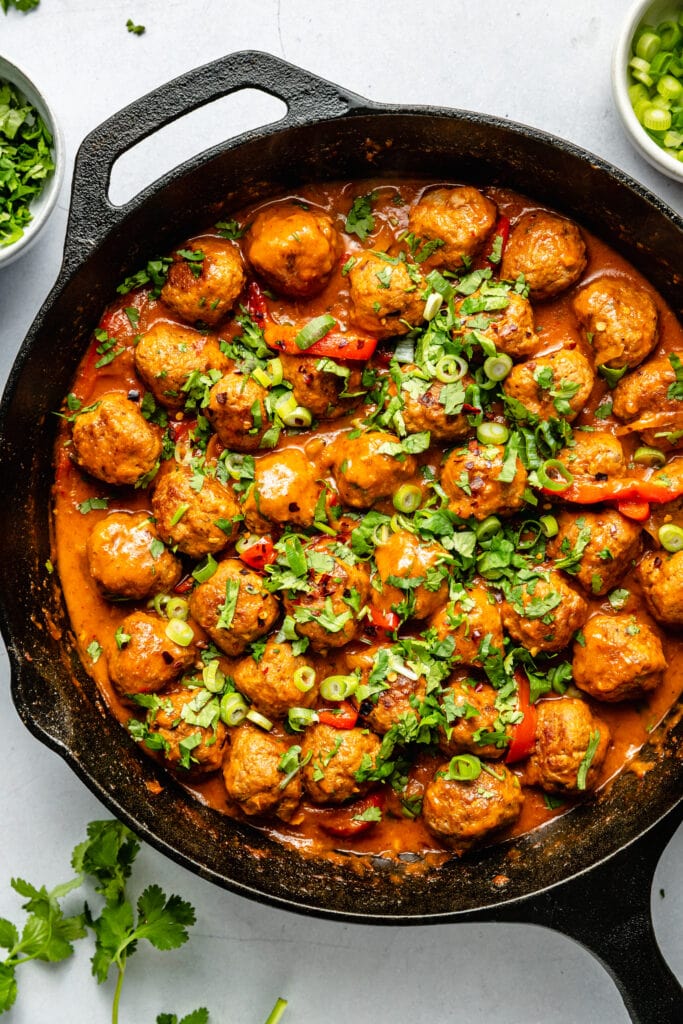 red curry meatballs in skillet