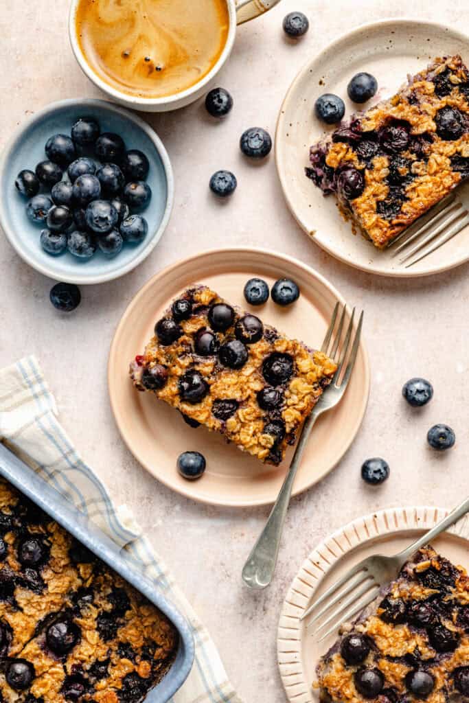 blueberry baked oatmeal slices on plates with fork
