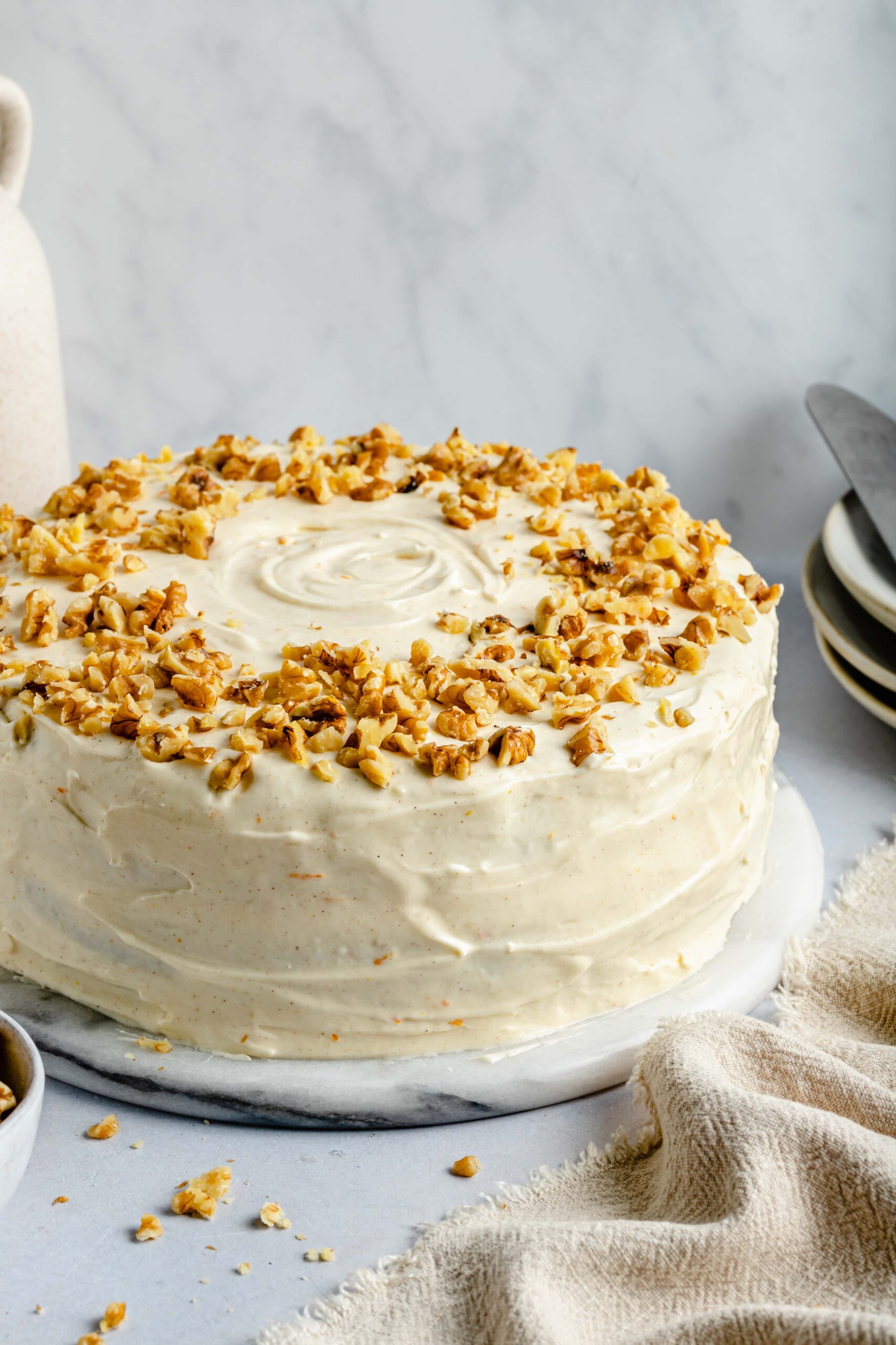 carrot cake topped with walnuts