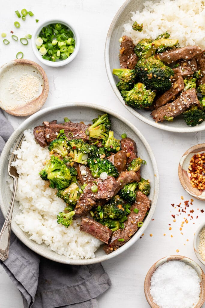 beef and broccoli over rice in bowl