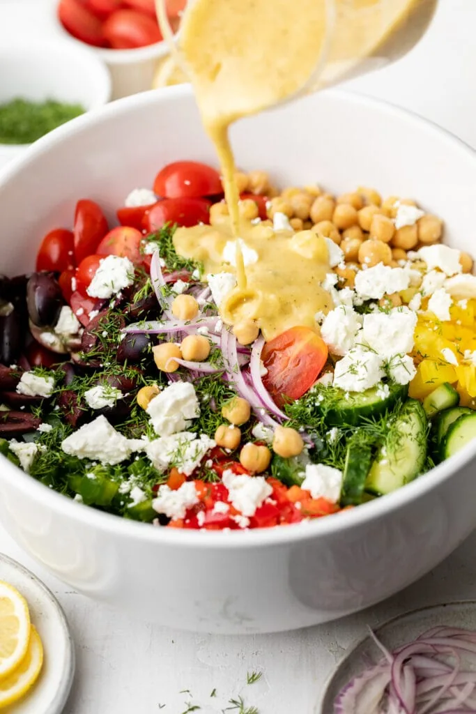 chickpea salad in bowl with dressing