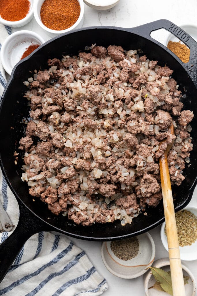 ground beef and onions in skillet
