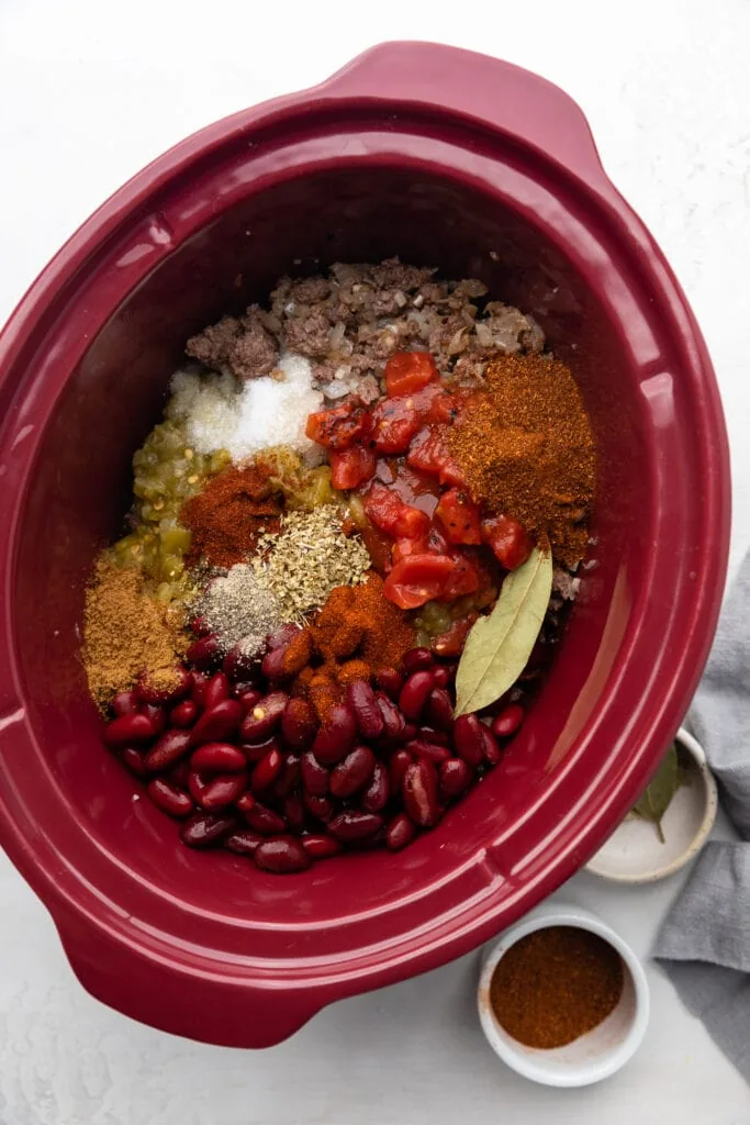 spices over meat in slow cooker cooke