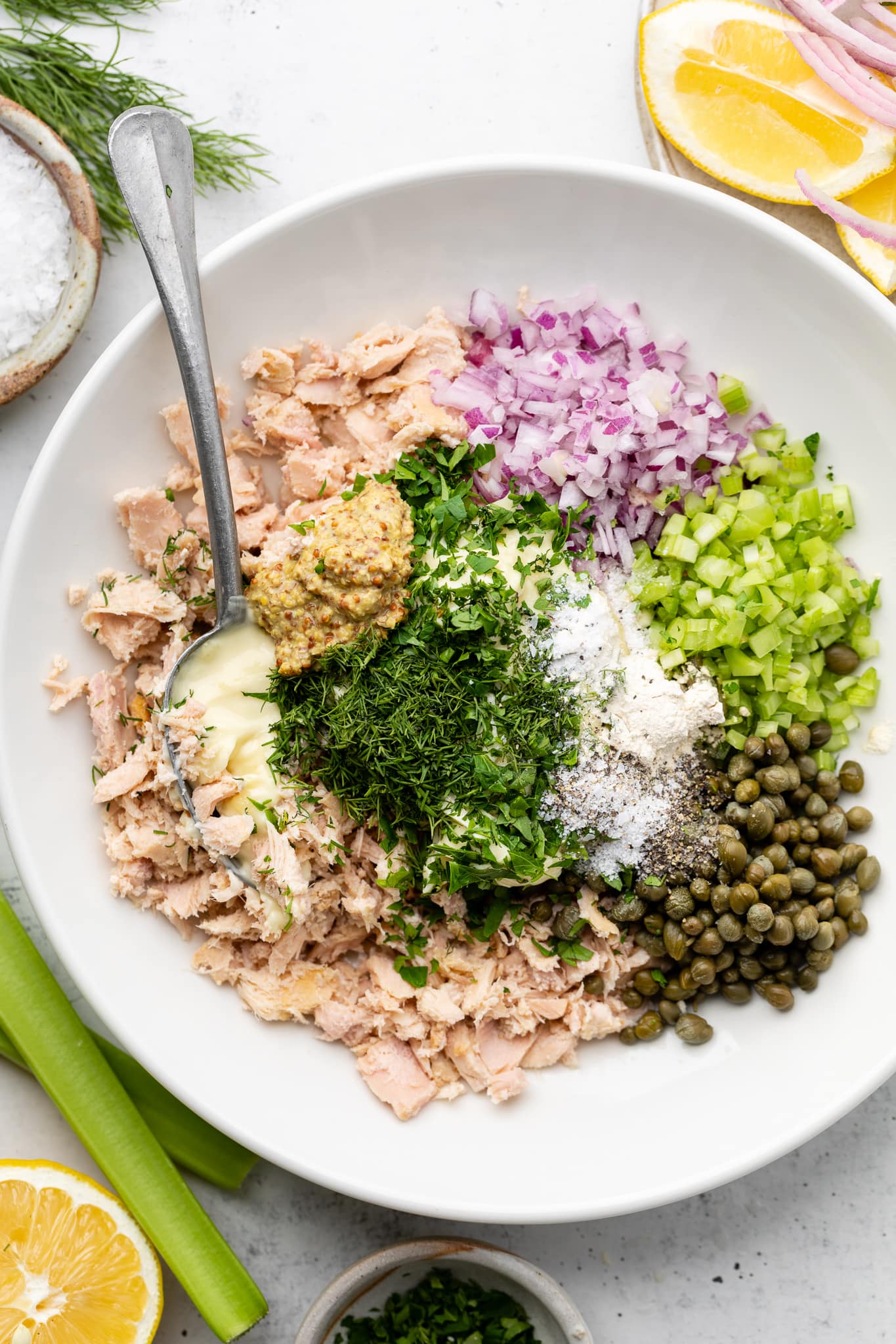 tuna salad ingredients in mixing bowl