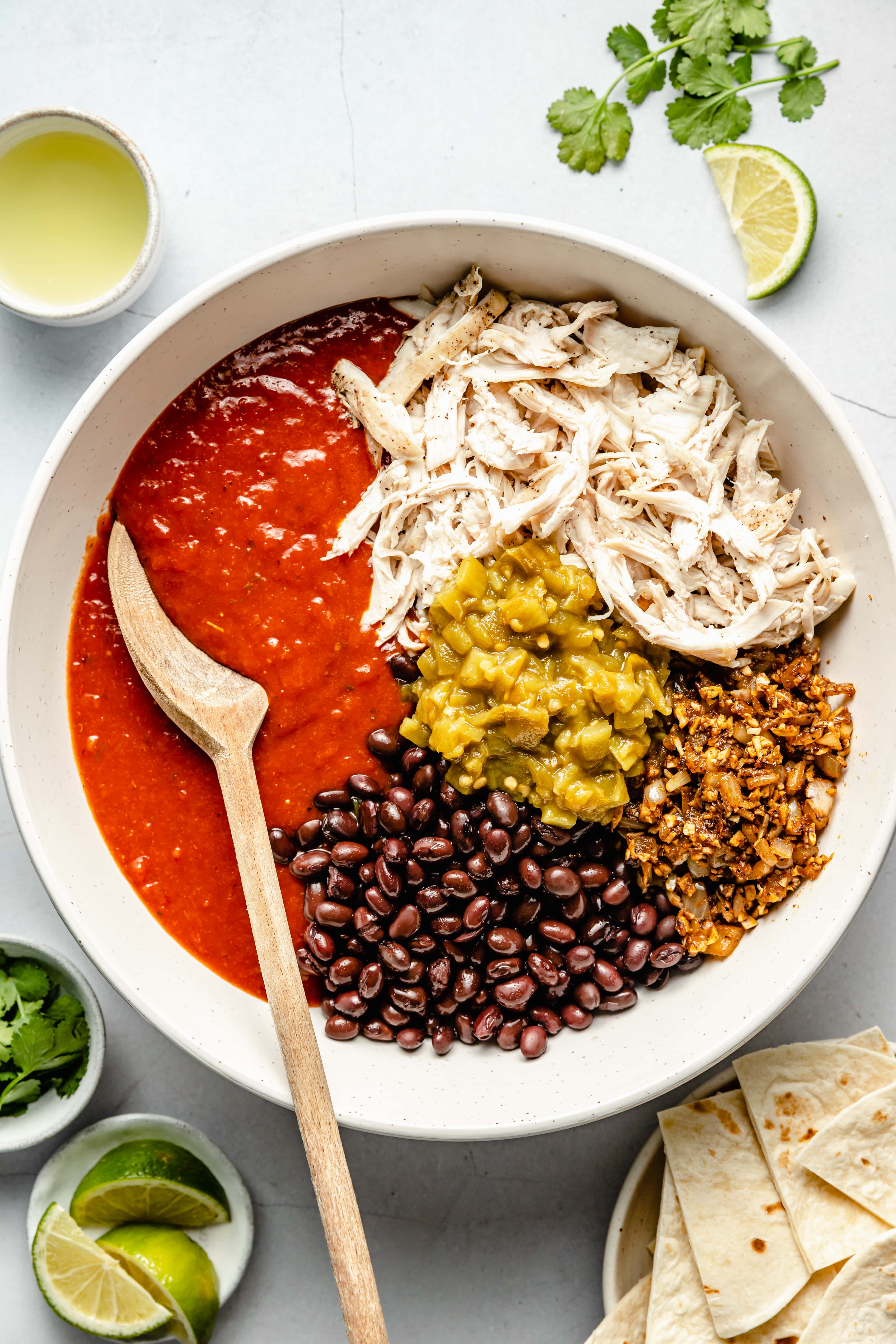 chicken enchilada skillet ingredients in large mixing bowl