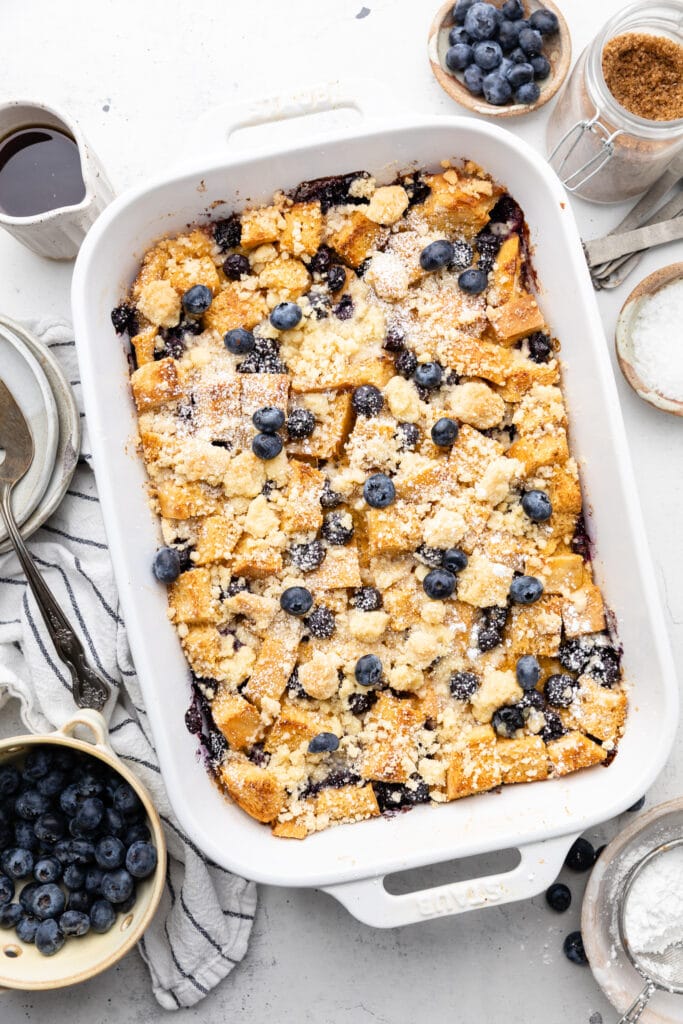 casserole with powdered sugar and blueberries