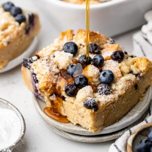 French toast casserole on plate with syrup