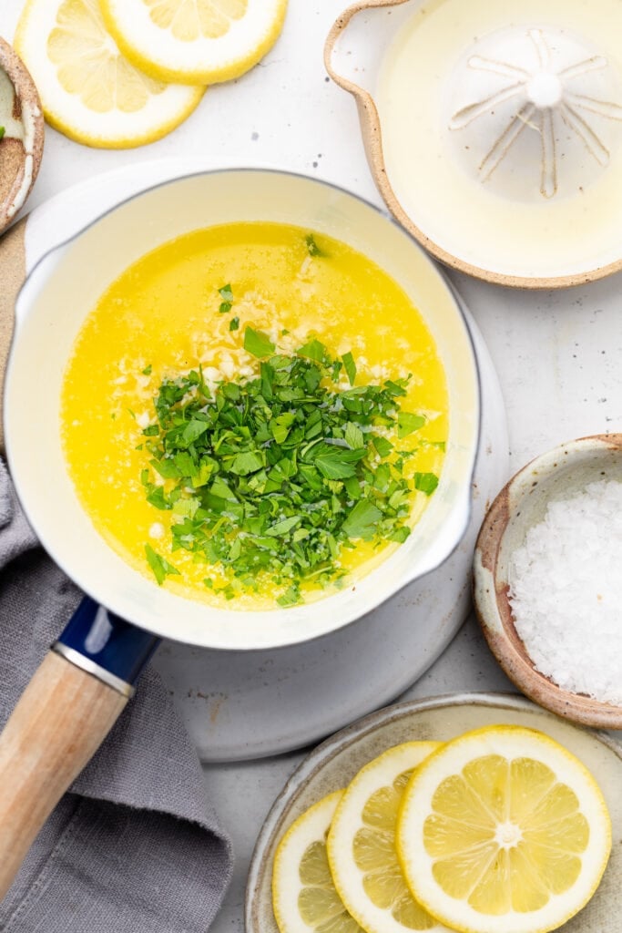 melted butter in pot with herbs