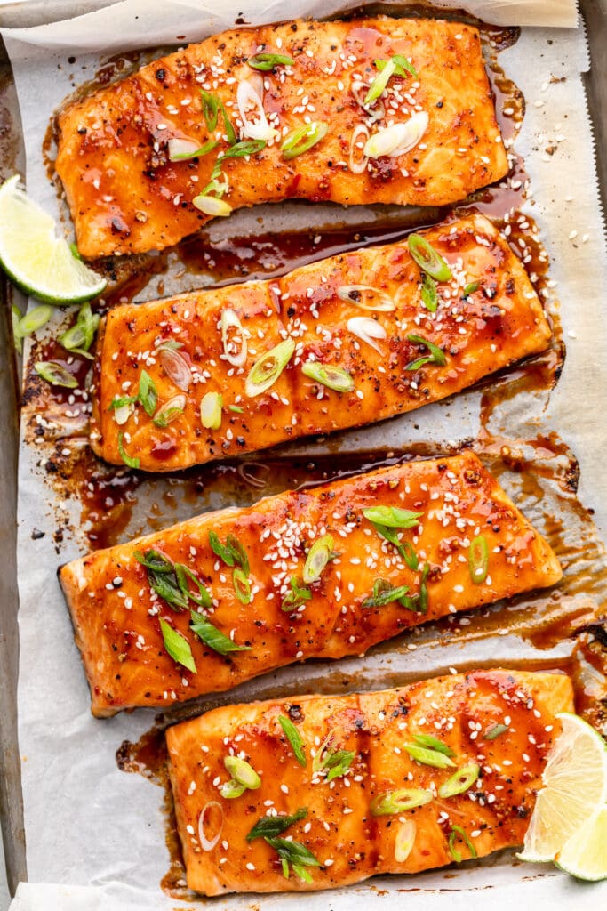 salmon on parchment lined sheet pan