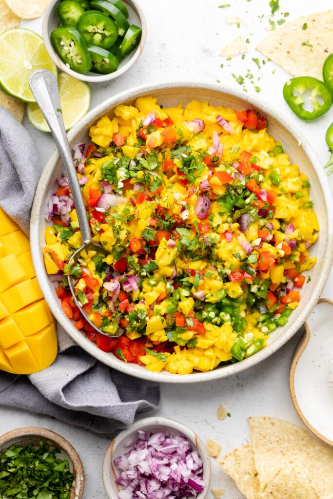 mango salsa in bowl with spoon