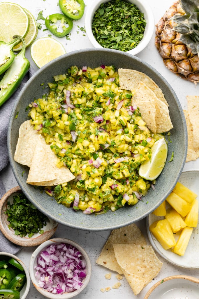 pineapple salsa in bowl with chips