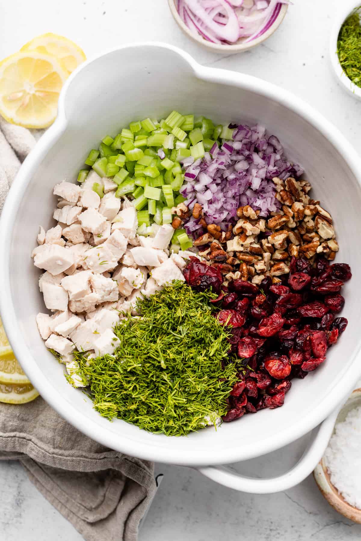 chicken salad ingredients in mixing bowl
