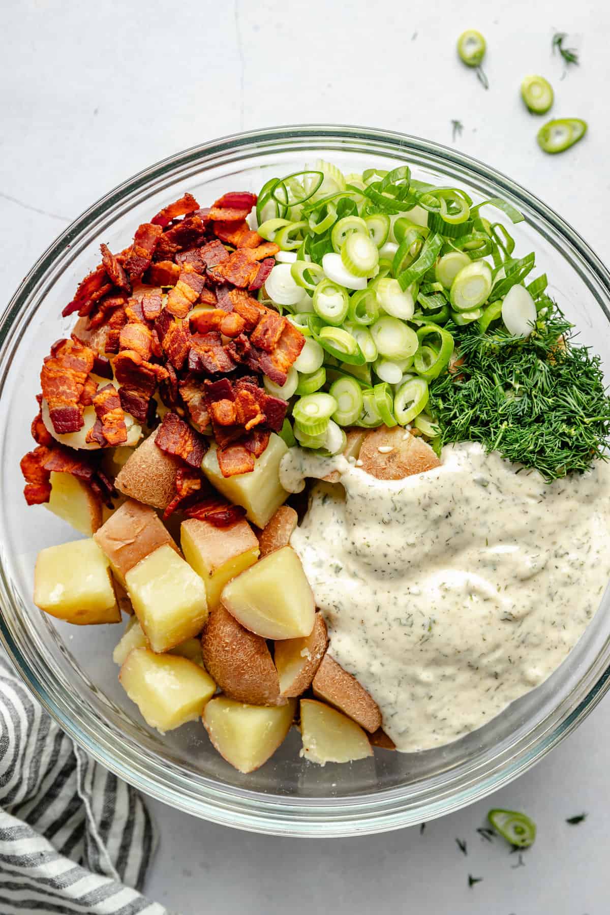 potato salad ingredients in mixing bowl