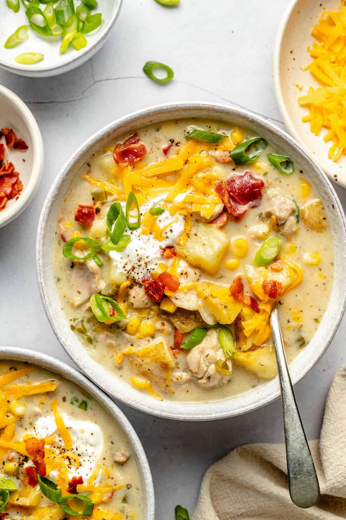 chowder in bowl with toppings