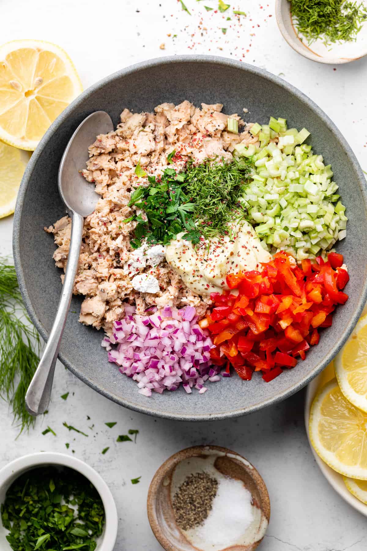 salmon salad ingredients in a mixing bowl