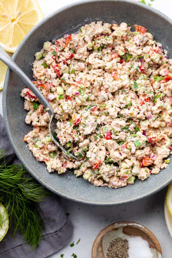 salmon salad in bowl with spoon