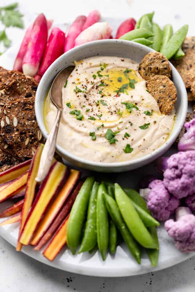 white bean dip in bowl with spoon