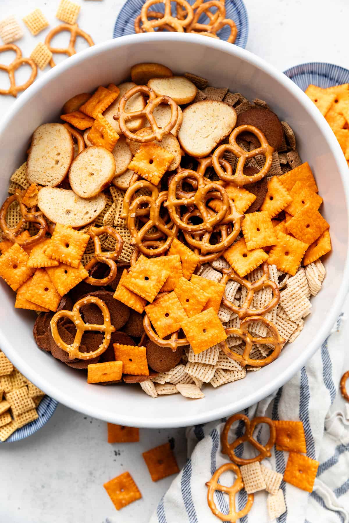 Chex mix ingredients in mixing bowl