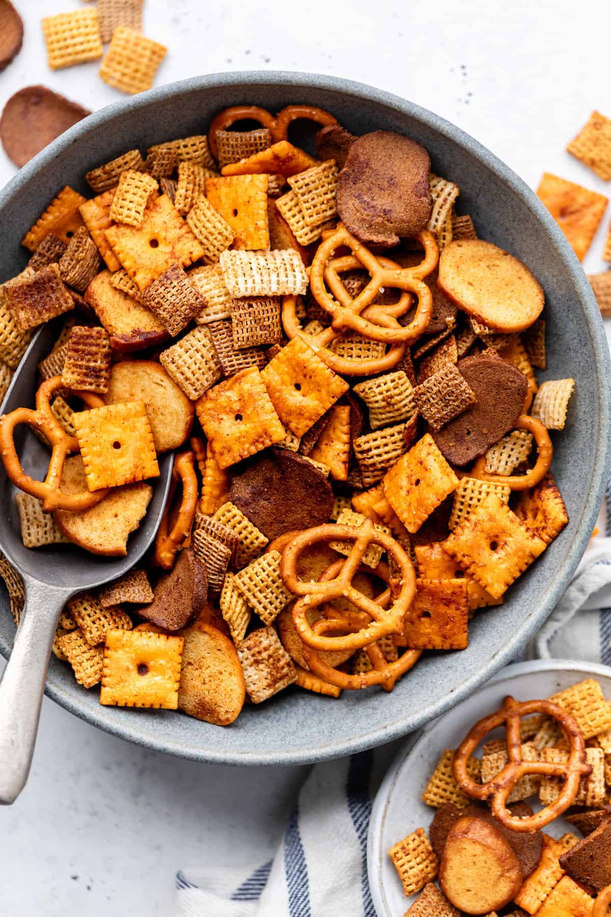 chex mix in serving bowl with spoon