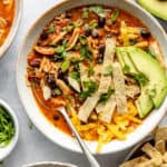 healthy chicken tortilla soup in bowl with spoon