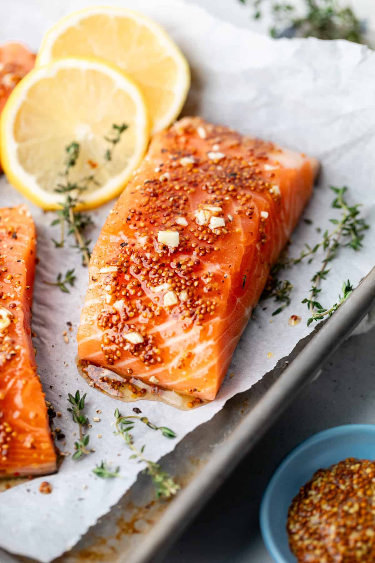 uncooked salmon on parchment lined pan