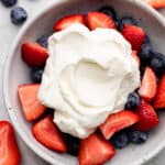 whipped cream and berries in bowl