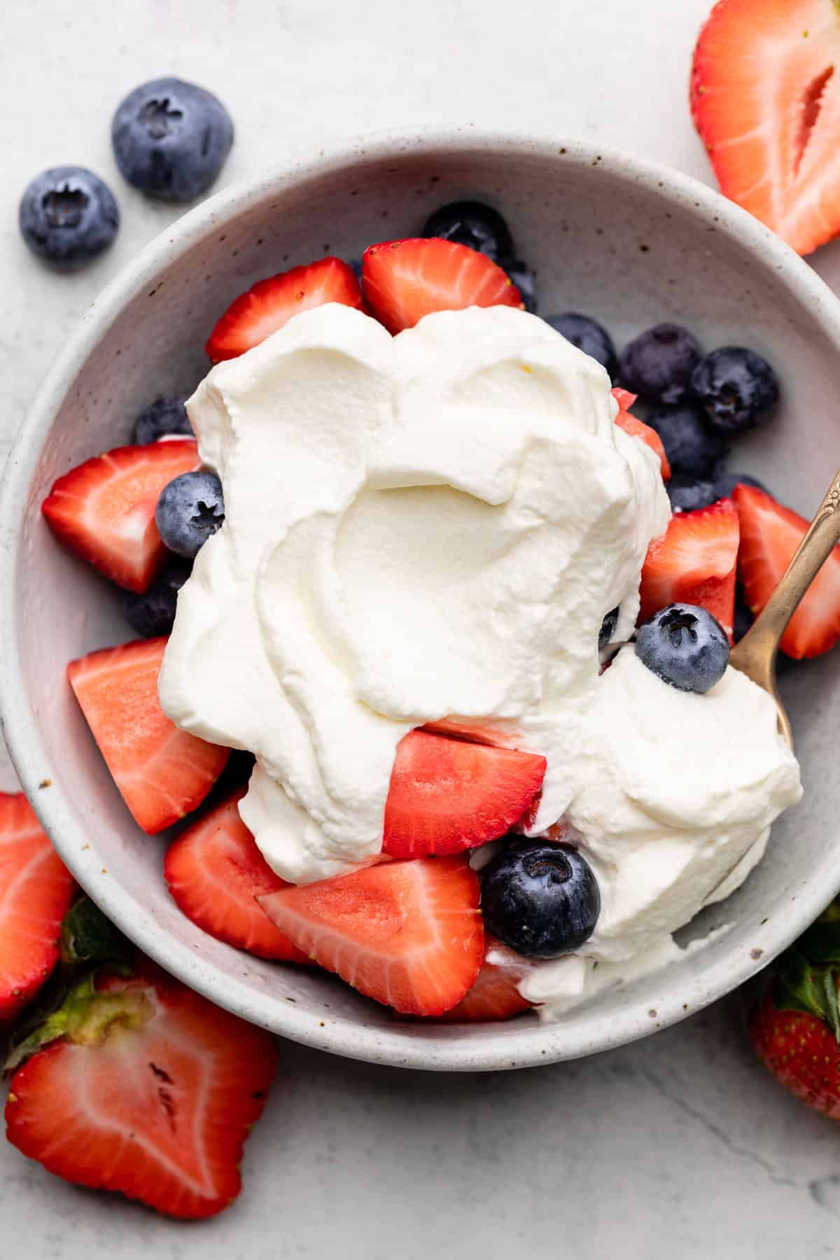 whipped cream and berries in bowl