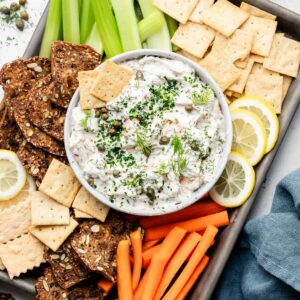 smoked salmon dip in bowl with crackers