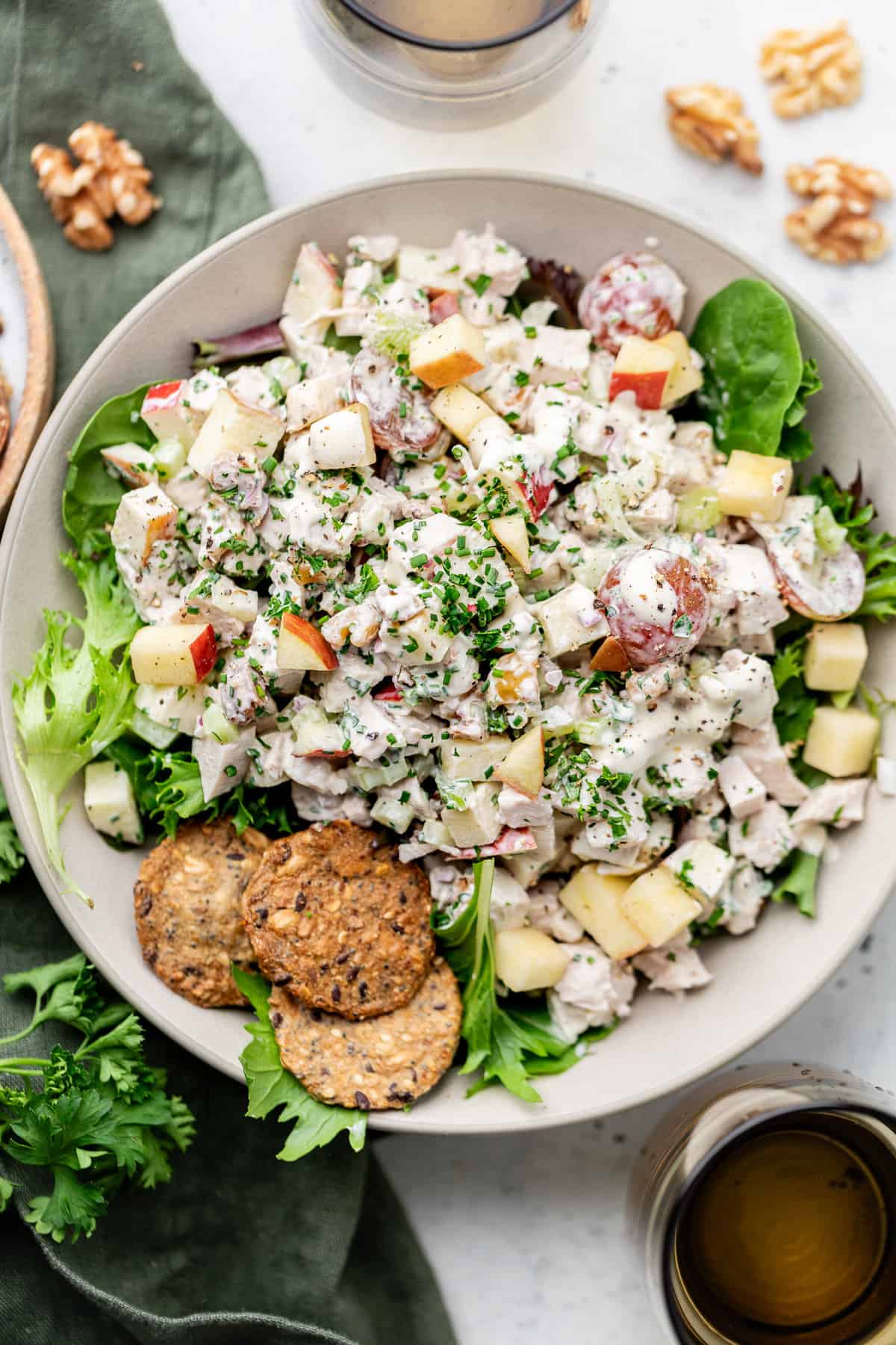Waldorf chicken salad in bowl with greens
