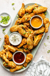 wings on plate with dipping sauces