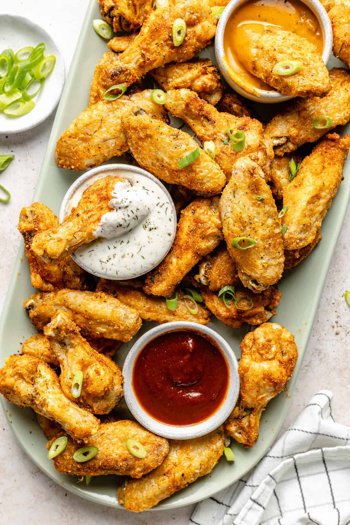wings on platter with sauces