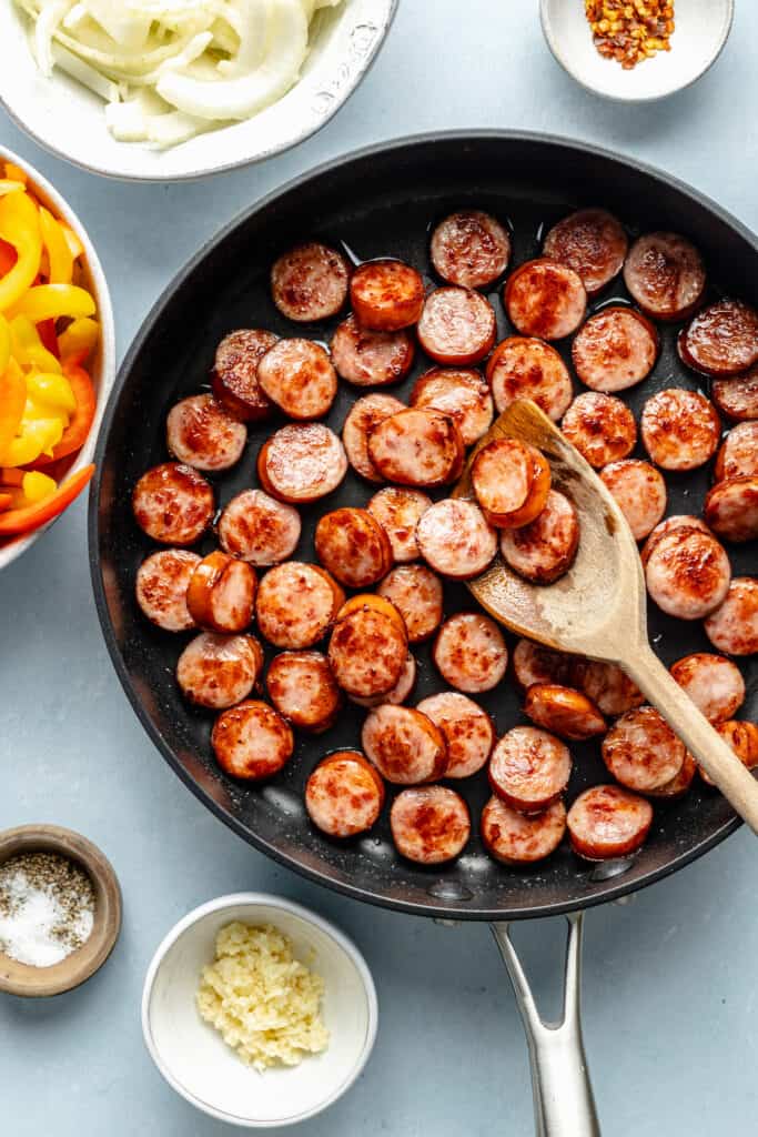 sausage sautéing in skillet