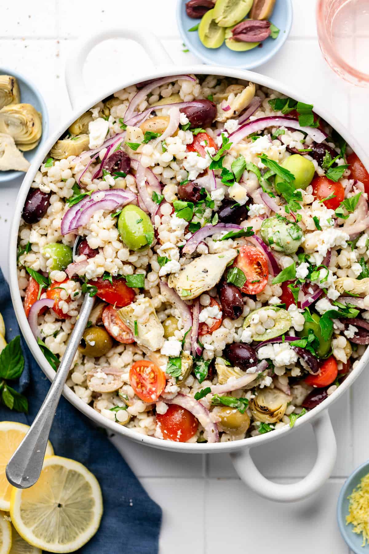 couscous salad in serving bowl with spoon
