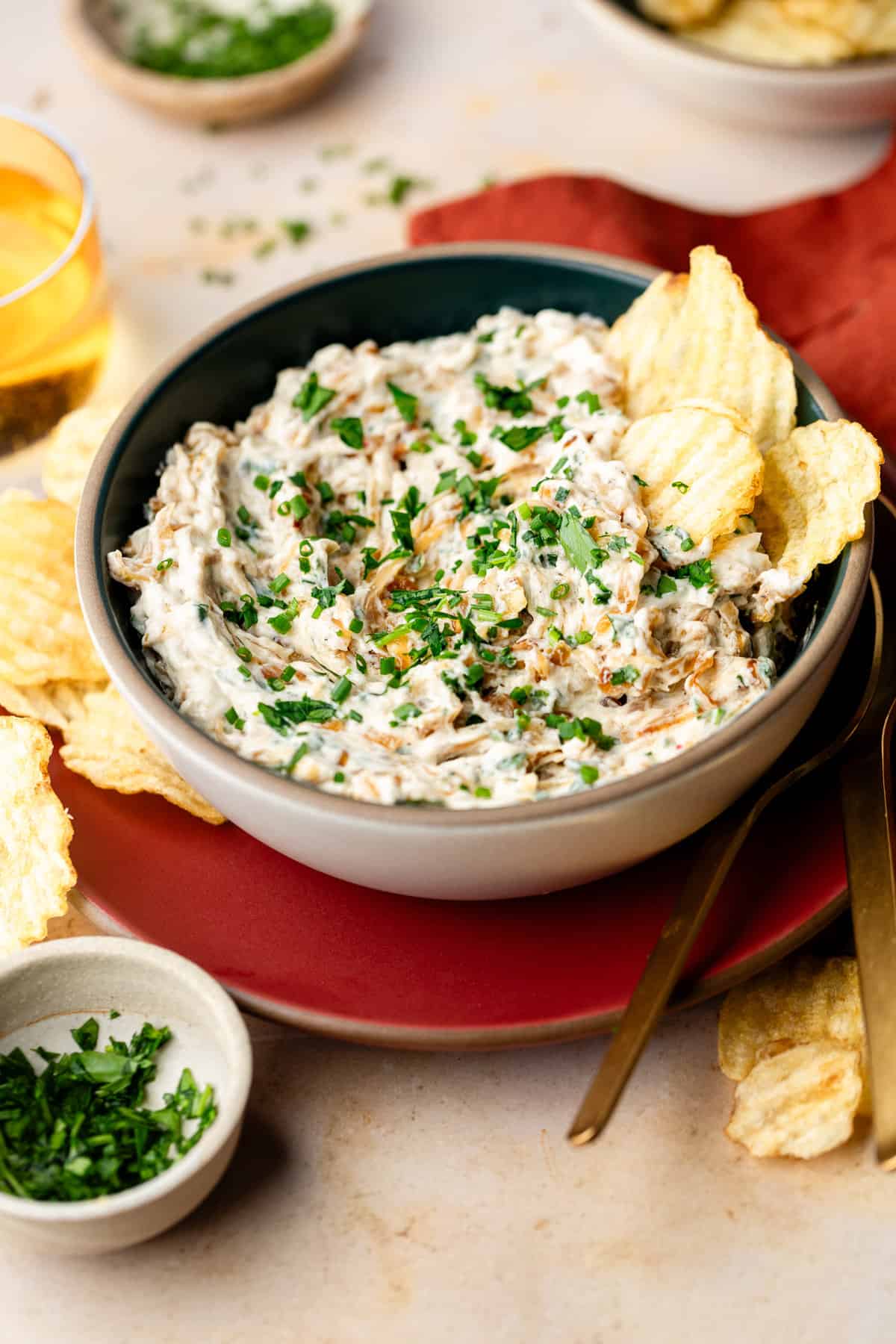 French onion dip in a bowl with potato chips