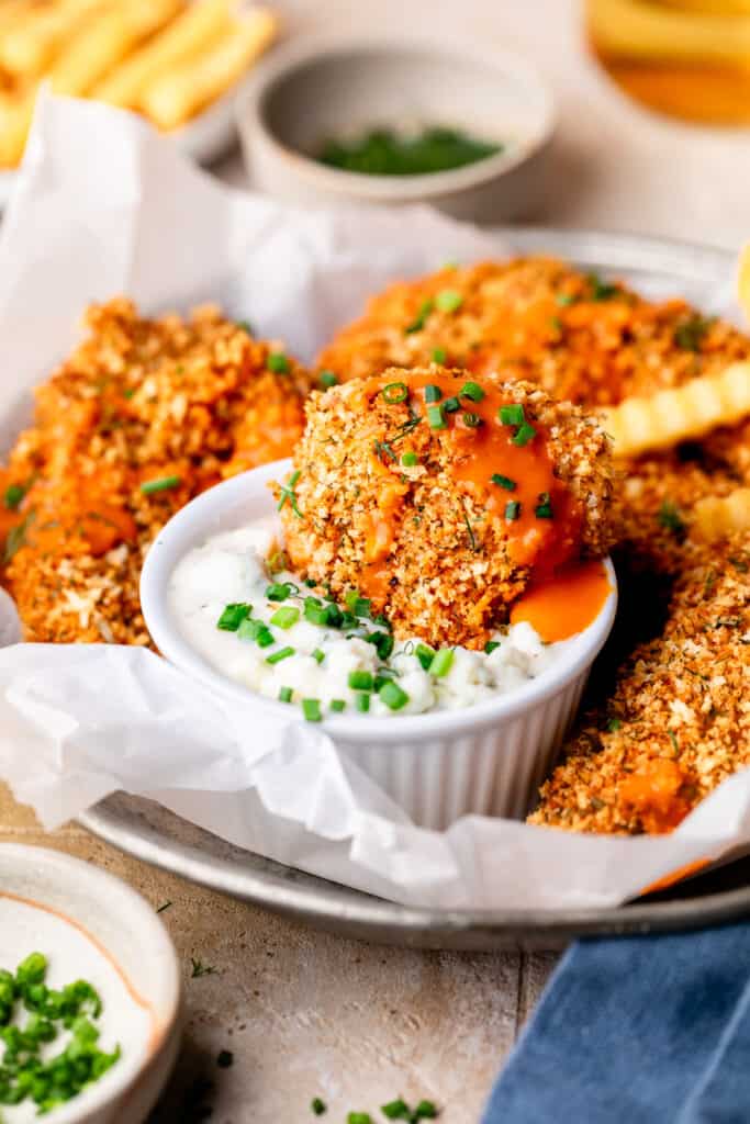 buffalo chicken tender dipped in blue cheese dressing 