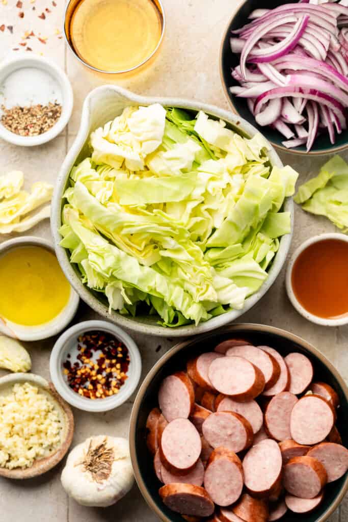 cabbage and sausage ingredients in bowls