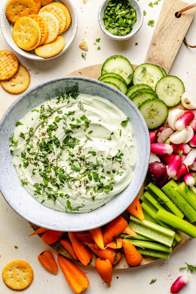 dip in bowl on serving board with veggies