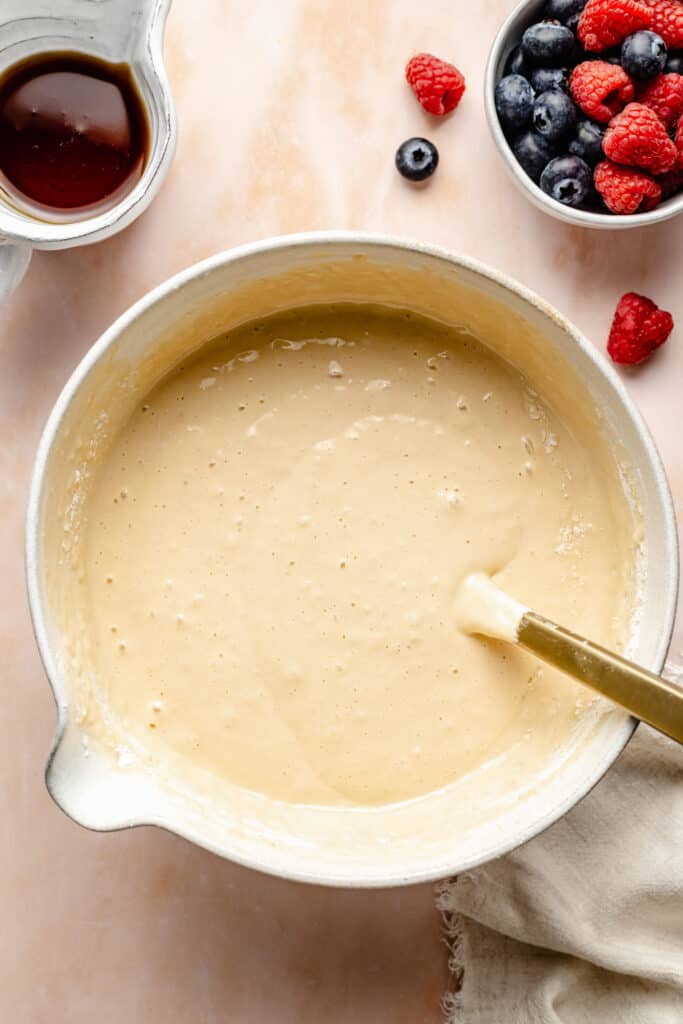 pancake batter in mixing bowl with spatula
