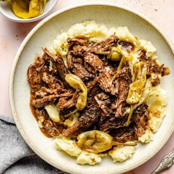 shredded pot roast served over mashed potatoes