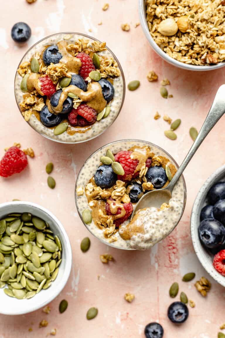 chia seeds in glass with toppings and spoon