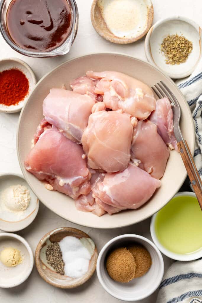 ingredients for baked bbq chicken thighs in small bowls