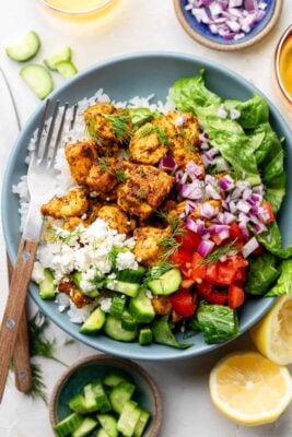 chicken with rice and veggies in bowl with fork
