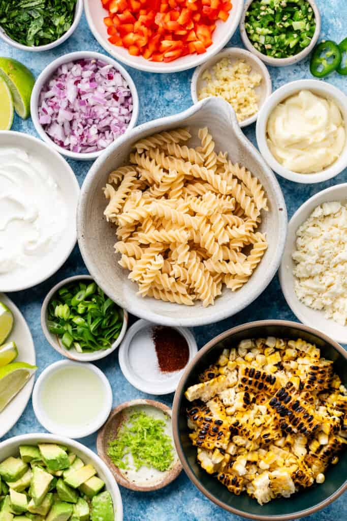 street corn pasta salad ingredients in small bowls