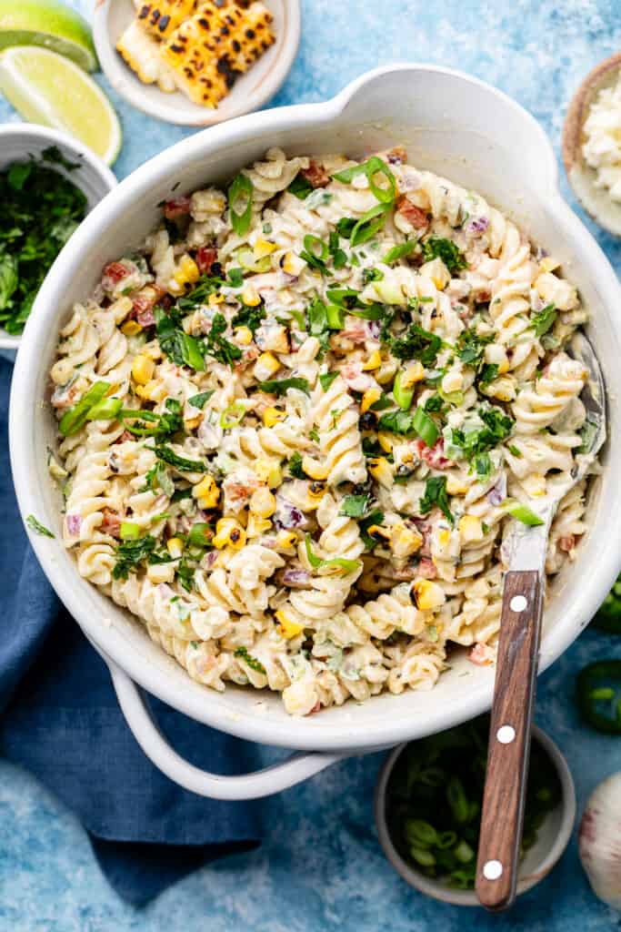 pasta salad in mixing bowl with fork