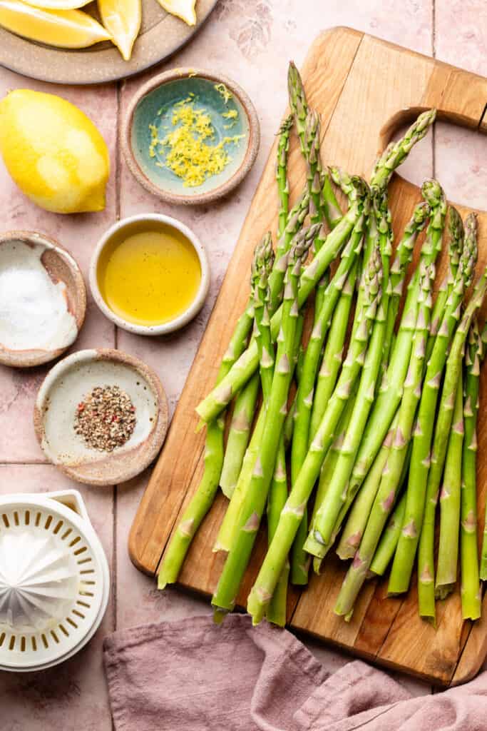 roasted asparagus ingredients in small bowls and a cutting board